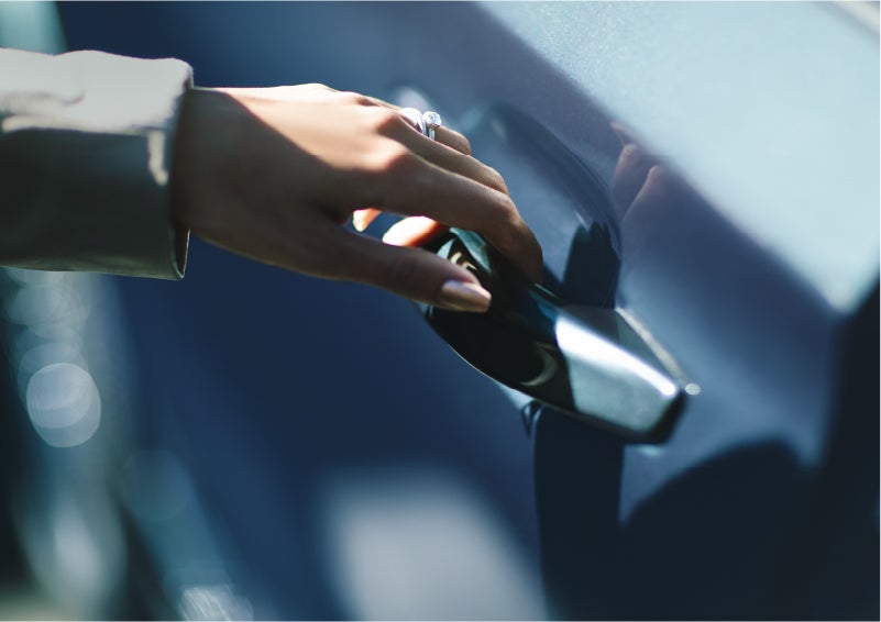 A hand gracefully grips the Light Touch Handle of a 2023 Lincoln Aviator® SUV to demonstrate its ease of use | Joe Cooper Lincoln of Edmond in Oklahoma City OK
