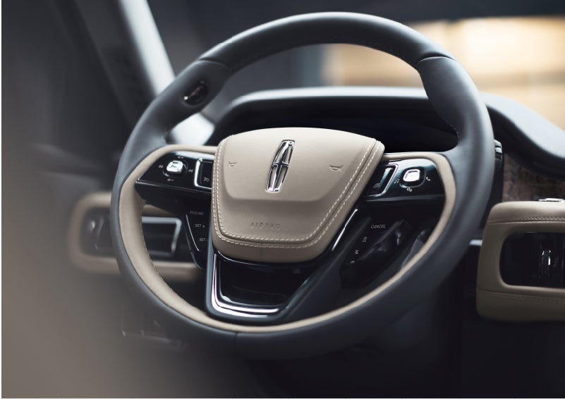 The intuitively placed controls of the steering wheel on a 2023 Lincoln Aviator® SUV | Joe Cooper Lincoln of Edmond in Oklahoma City OK