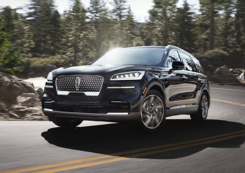 A Lincoln Aviator® SUV is being driven on a winding mountain road | Joe Cooper Lincoln of Edmond in Oklahoma City OK