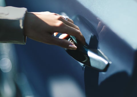 A hand gracefully grips the Light Touch Handle of a 2024 Lincoln Aviator® SUV to demonstrate its ease of use | Joe Cooper Lincoln of Edmond in Oklahoma City OK