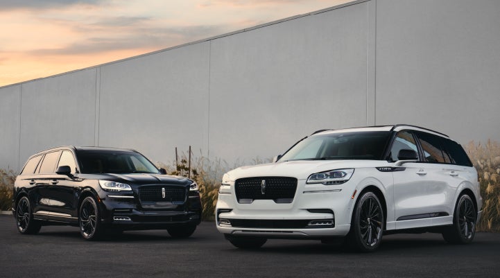 Two Lincoln Aviator® SUVs are shown with the available Jet Appearance Package | Joe Cooper Lincoln of Edmond in Oklahoma City OK