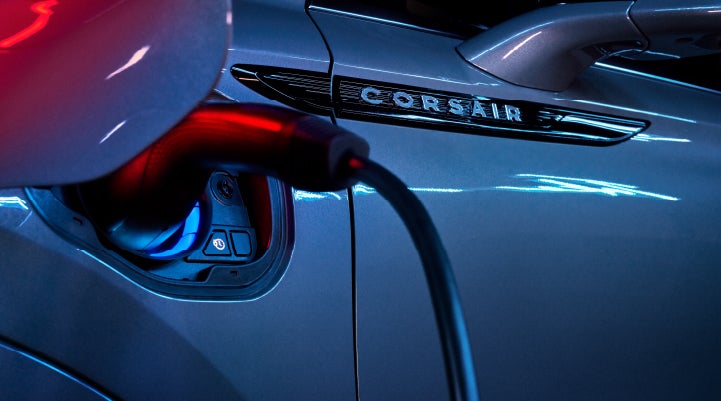 A charger plugged into the charging port of a 2024 Lincoln Corsair® Plug-in Hybrid model. | Joe Cooper Lincoln of Edmond in Oklahoma City OK